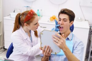 female dentist showing teeth to patient 2022 01 20 19 45 51 utc 1