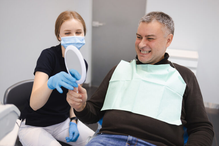 female dentist doctor showing the result of a teet 2022 02 17 20 18 29 utc 1